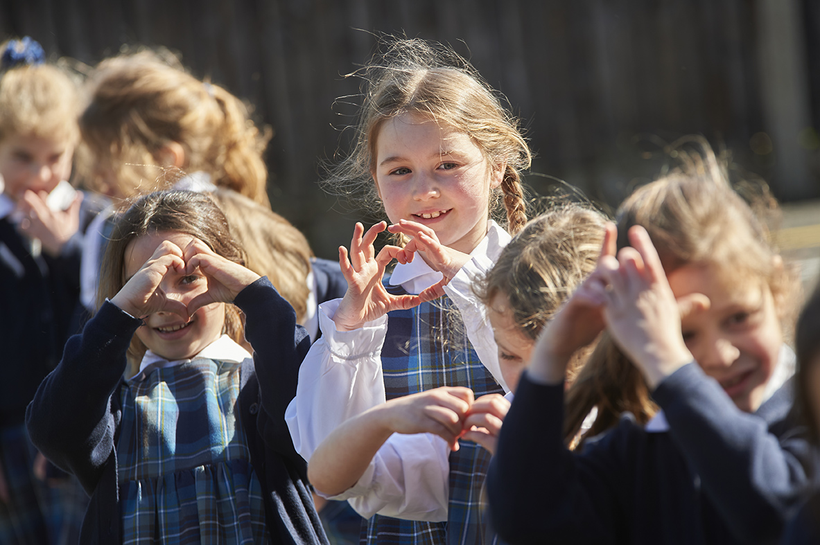 Study girls making heart shapes at Wilberforce House