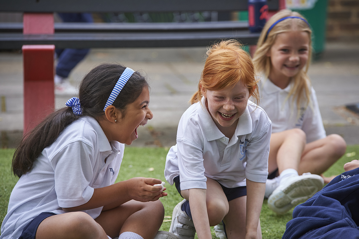 Study girls laughing in Wilberforce House playground