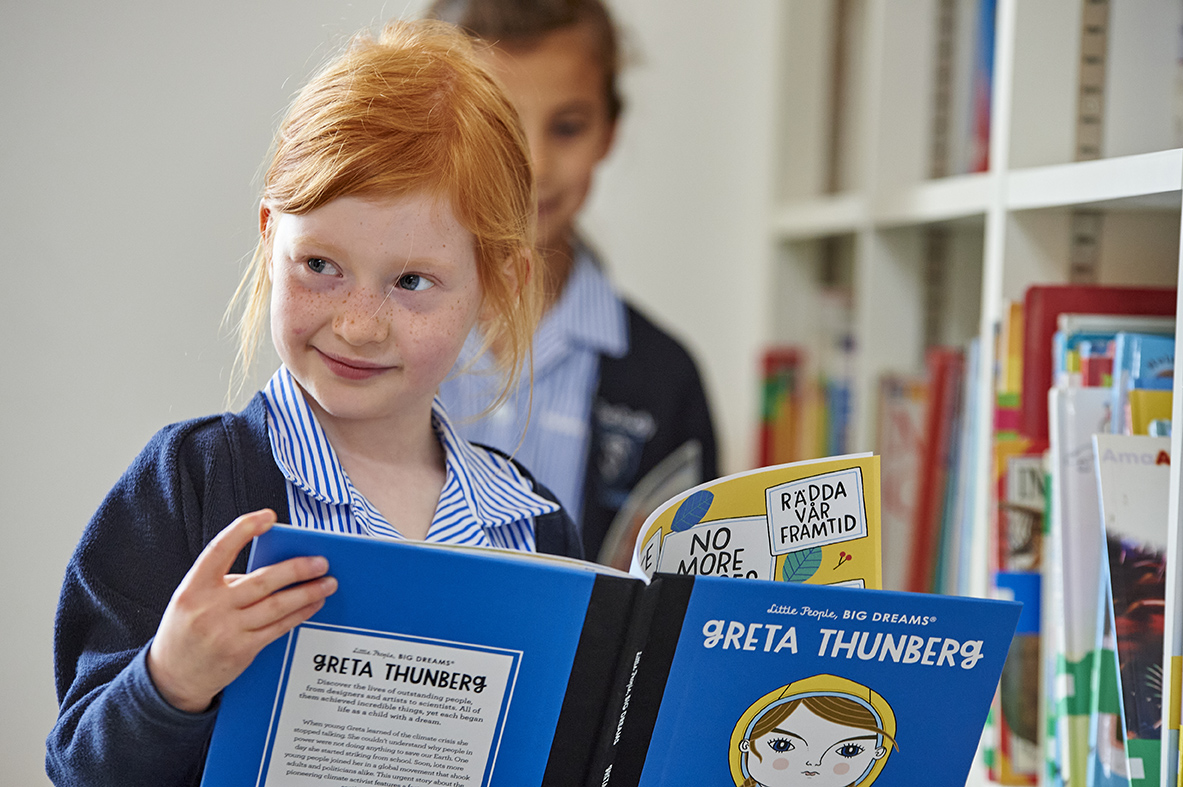 Study girl reading in the library