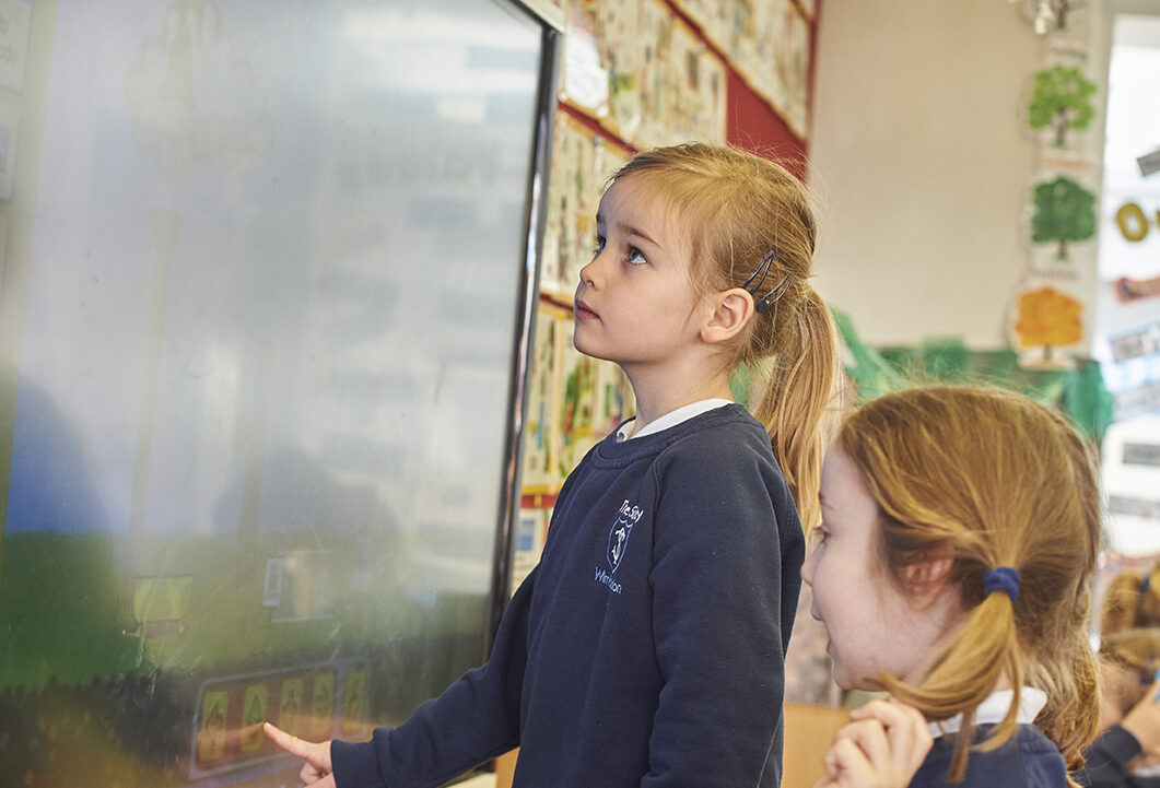 Study girl using digital screen in Reception