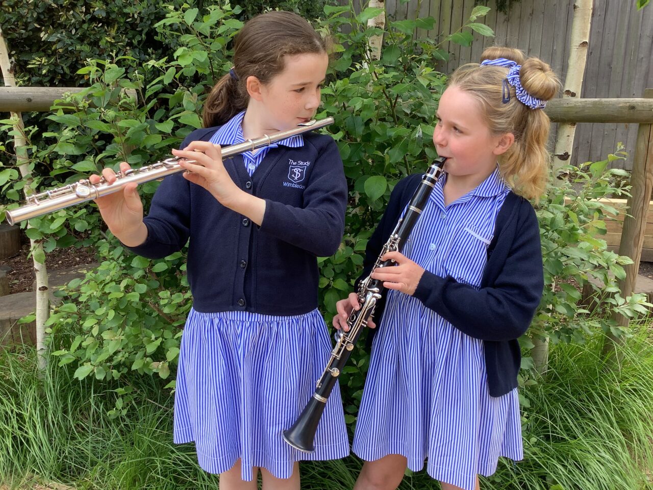 Study girls playing wind instruments
